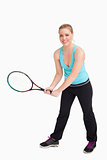 Woman holding a racquet with her two hands