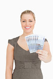 Woman showing her euro banknotes