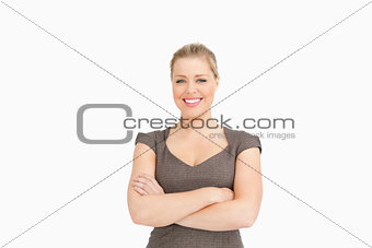 Woman smiling with her arms crossed