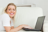 Woman writing on a laptop