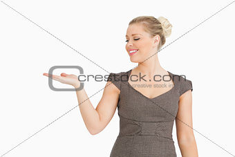 Woman presenting with her hand