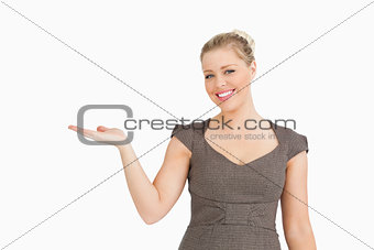 Woman presenting something with her hand