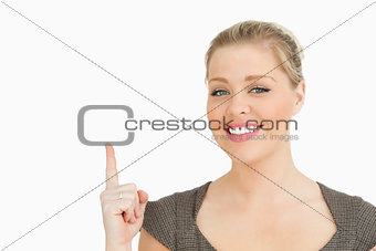 Woman smiling pointing something