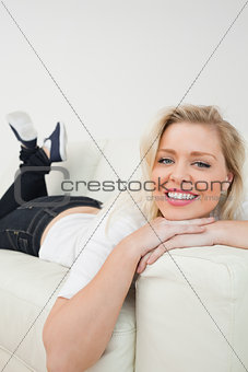 Woman smiling while lying