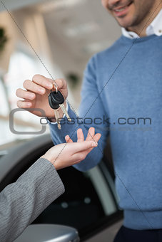 Smiling man holding keys