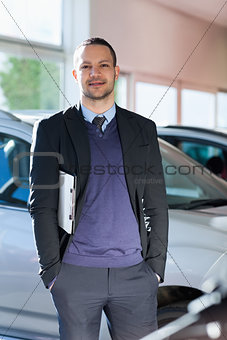 Man standing beside a car