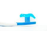 Blue toothpaste on a toothbrush