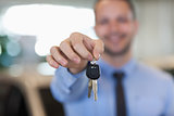 Man holding car keys by his fingertips