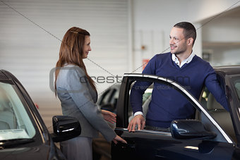 Woman opening car door 