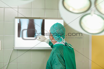 Surgeon checking x-rays