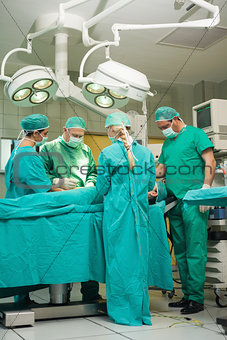 Team of surgeons working on a patient