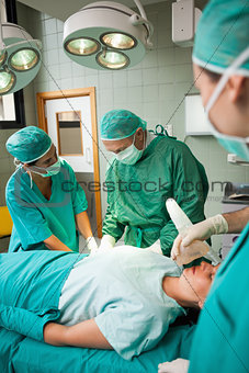 Medical team of surgeon working