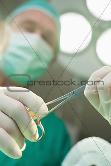 Surgeon holding scissors