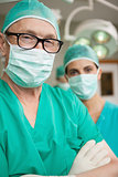 Surgeon crossing his arms with a colleague