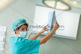 Surgeon holding a radiography