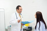 Doctor and patient talking together