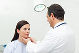 Doctor auscultating the neck of his patient