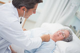 Patient is auscultating with a doctor