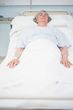 Elderly patient lying on a bed