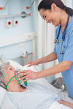 Nurse holding an oxygen mask
