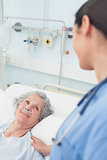Smiling patient looking at a nurse