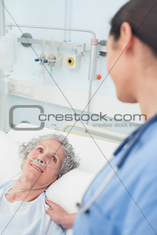 Smiling patient looking at a nurse