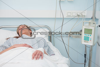 Woman sleeping on a medical bed
