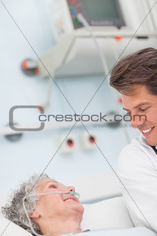 Patient smiling to a doctor