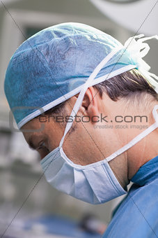 Serious doctor performing surgery