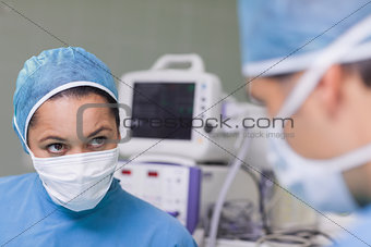 Nurse looking at a doctor