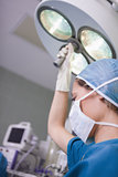 Nurse moving the surgical light 