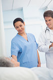 Doctor and nurse looking at a patient