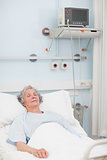 Elderly patient lying with closed eyes