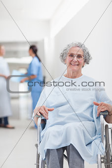 Elderly patient in a wheelchair in a corridor