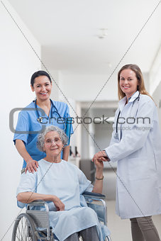 Doctor next to a patient on wheelchair