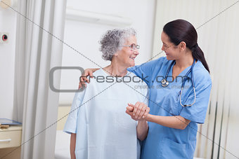 Nurse and a patient standing