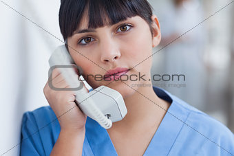 Nurse holding a phone