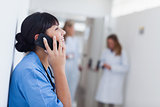 Smiling nurse holding a mobile phone