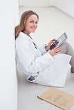 Doctor using an ebook while sitting