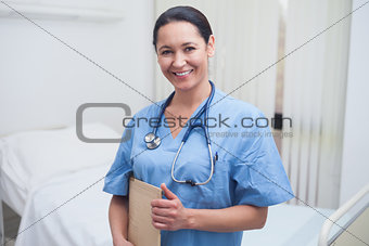 Nurse holding a medical folder