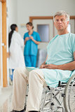 Patient in a wheelchair looking at camera