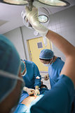 Nurse illuminating the operating table