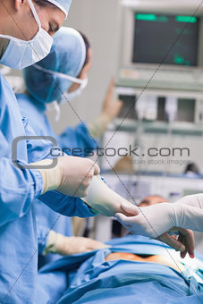 Doctor removing his gloves
