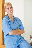 Nurse sitting with arms crossed
