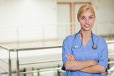 Blonde nurse looking at camera with arms crossed