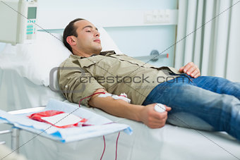 Transfused patient lying on a bed