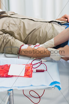 Blood bag next to male patient