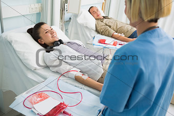 Transfused patients smiling to a nurse