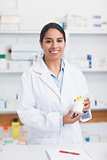 Pharmacist holding a drug box