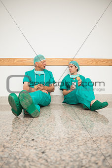 Surgeons sitting on the floor
